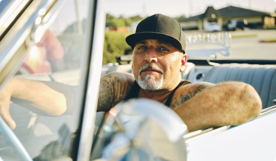 Man in car_iStock-2155935889